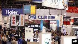 People walk around the trade show floor during the Consumer Electronics Show Friday, Jan. 7, 2011, in Las Vegas.