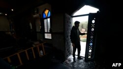 A Palestinian inspects the damage done to a mosque, after a reported attack by Israeli settlers, in the town of Marda near the West Bank city of Salfit on Dec. 20, 2024.