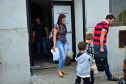 Lucia Ascencio of Venezuela, her husband and their two sons, arrive back to Nuevo Laredo, Mexico, as part of the first group of migrants to be returned to Tamaulipas state as part of a program for U.S. asylum-seekers, July 9, 2019.