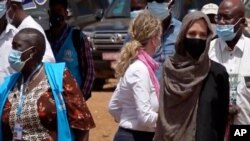 United Nations High Commissioner for Refugees Angelie Jolie, right, visits the Malian refugee camp in Goudebo, Burkina Faso, June 20, 2021, to mark World Refugee day.