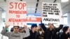 FILE - People take part in a demonstration against the deportation of some 50 Afghan refugees from Munich airport, southern Germany, Feb. 22, 2017. The Afghan government is asking the Trump administration to halt the deportation of Afghan nationals in the United States.