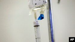 FILE - Chemotherapy drugs are administered to a patient at North Carolina Cancer Hospital in Chapel Hill, May 25, 2017.