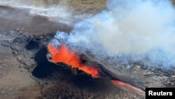 FILE - Lava spurts and flows after the eruption of a volcano in the Reykjanes Peninsula, Iceland, July 12, 2023. New concerns about another possible eruption led to the evacuation of Grindavik on Nov. 11. (Civil Protection of Iceland via Reuters)