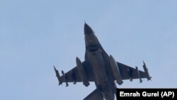 FILE - A Turkish war plane is seen in the sky.