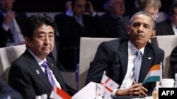 Yaponiya bosh vaziri Shinzo Abe va AQSh prezidenti Barak Obama Gaagadagi yadro xavfsizligi sammitining ochilish marosimida, 24-mart, 2014-yil. 