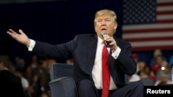 FILE - Republican presidential candidate Donald Trump addresses the crowd during a forum in Aiken, S.C., Dec. 12, 2015. 