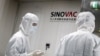People work in a laboratory of Chinese vaccine maker Sinovac Biotech, developing an experimental COVID-19 vaccine, during a government-organized media tour in Beijing, China, Sep. 24, 2020.