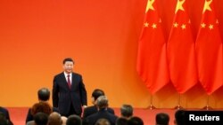 Le président Xi a prononcé son discours depuis la porte Tiananmen, l'endroit même où son lointain prédécesseur Mao Tsé-toung proclama la République populaire le 1er octobre 1949.