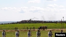 FILE - Turkish soldiers secure the border line between Turkey and Syria near the town of Suruc, Sanliurfa province, March 17, 2015.