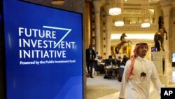 A participant at the Future Investment Initiative walks in the Ritz Carlton Hotel a day before the event, in Riyadh, Saudi Arabia, Oct. 28, 2019. 