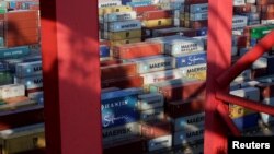 Containers are seen at the Yangshan Deep Water Port, part of the Shanghai Free Trade Zone, in Shanghai, China, Sept. 24, 2016. 