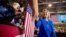 Democratic presidential candidate Hillary Clinton greets a member of the audience as she arrives to speak at a rally at Johnson C. Smith University in Charlotte, N.C., Sept. 8, 2016.