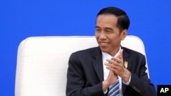 Presiden Joko Widodo dalam pertemuan di Beijing, Maret 2015.