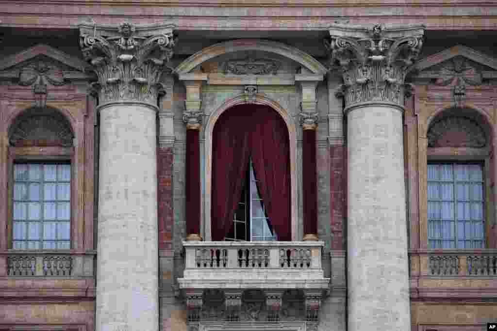 A view of the balcony on the facade of Saint Peter&#39;s Basilica where the newly elected pope will make his first appearance to salute the cheering crowd, at the Vatican, March 11, 2013. 