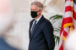 Justice Neil Gorsuch stands during a private ceremony for Justice Ruth Bader Ginsburg at the Supreme Court in Washington, Wednesday, Sept. 23, 2020 (AP Photo/Andrew Harnik, Pool)
