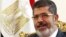Egypt's President Mohamed Mursi attends a meeting at the presidential palace in Cairo, May 16, 2013.