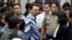 Jakarta Governor Basuki "Ahok" Tjahaja Purnama, center, talks to his lawyers after his sentencing hearing at a court in Jakarta, Indonesia, May 9, 2017. 