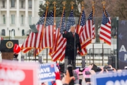 FILE - President Donald Trump holds a rally to contest the certification of the 2020 U.S. presidential election results by Congress, in Washington, Jan. 6, 2021.