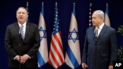 U.S. Secretary of State Mike Pompeo, left, and Israeli Prime Minister Benjamin Netanyahu stand during statements to the press during a meeting at the Prime Minister's residence in Jerusalem, Oct. 18, 2019. 
