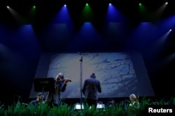 Violinist Simon Garcia plays an adaptation of Antonio Vivaldi's famous “The Four Seasons” concertos on International Day against Climate Change in Madrid, Spain, October 24, 2023. (REUTERS/Susana Vera)