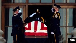 The casket of Ruth Bader Ginsburg is brought to the front of the Supreme Court for two days of public viewing in Washington, DC on September 23, 2020.
