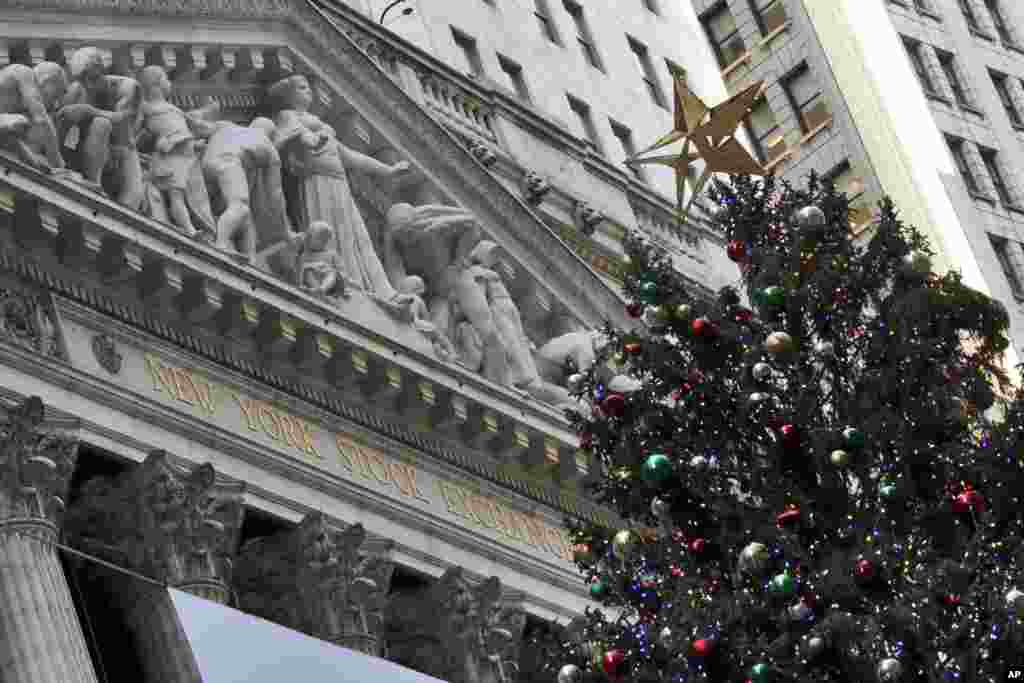 The 93rd annual New York Stock Exchange Christmas Tree lights up Broad Street in Manhattan, New York.