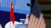 FILE - The Chinese and U.S. national flags are seen before the start of a Treaty on the Non-Proliferation of Nuclear Weapons conference with the U.N. Security Council's five permanent members, in Beijing, Jan. 30, 2019.