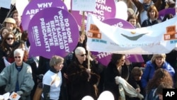 Women are joining together in London for Women International's 'Join me on the Bridge' campaign 2011