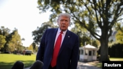 U.S. President Donald Trump talks to reporters as he departs for campaign travel to Ohio from the South Lawn at the White House in Washington, Sept. 21, 2020. 