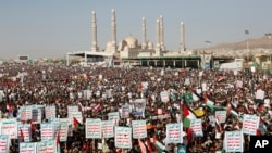 Houthi supporters attend a protest against the United States-led airstrikes on Jan 12, 2024, in Sanaa, Yemen.