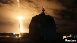 FILE - The U.S. Missile Defense Agency conducts an interceptor flight test from the Aegis Ashore Missile Defense Test Complex in Kauai, Hawaii, Dec. 10, 2015.