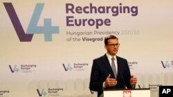 Polish Prime Minister Mateusz Morawiecki addresses the press in Budapest, Hungary, November 23, 2021.