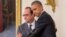 President Barack Obama and French President Francois Hollande embrace during a joint news conference in the East Room of the White House in Washington, Nov. 24, 2015.