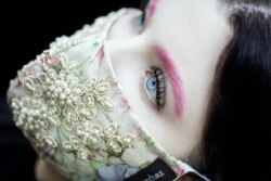 Photographer Kelsey Sasser in Atlanta wears a sold-out 'Moneta' white mask by Pheren Couture for a photoshoot. (Photo courtesy Kelsey Sasser)