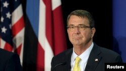 FILE - U.S. Secretary of Defense Ash Carter listens during a news conference in Tallinn, Estonia, June 23, 2015.