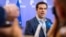 Greek Prime Minister Alexis Tsipras speaks with the media after a meeting of eurozone heads of state at the EU Council building in Brussels, July 13, 2015. 