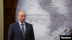 FILE - Russian President Vladimir Putin at event in St. Petersburg, June 5, 2014.