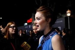Cast member Emma Stone is interviewed at the premiere of "La La Land" in Los Angeles, Dec. 6, 2016. The musical was named one of 2016's top 10 movies by the American Film Institute, Thursday, Dec. 8, 2016.