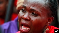 A woman attends a demonstration calling on the government to rescue the kidnapped Chibok school girls, outside the defense headquarters in Abuja, Nigeria, May 6, 2014. 