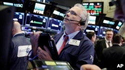 Trader Fran O'Connell works on the floor of the New York Stock Exchange, March 26, 2018. U.S. stocks rose sharply in early trading Monday as the market made up some of its huge losses from last week.