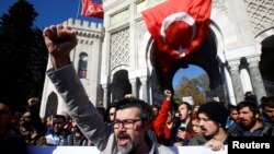 FILE - Demonstrators protest against a purge of thousands of education staff since an attempted coup in July in front of the Istanbul University, November 3, 2016. 