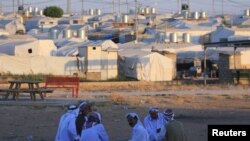 Displaced Iraqi men from the minority Yazidi sect, who fled the Iraqi town of Sinjar, are seen at the Khanki camp on the outskirts of Dohuk province, July 31, 2019.