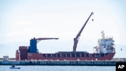 FILE - Russian vessel Lady R docked near Cape Town, South Africa, Dec. 8, 2022. A presidential inquiry in South Africa found government officials didn't know the U.S.-sanctioned ship was assigned to deliver military equipment to the country until the vessel neared national waters