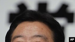 Japan's Finance Minister Yoshihiko Noda, who was chosen as the new leader of Japan's ruling Democratic Party, smiles during a news conference after the party's leadership vote in Tokyo. Finance Minister Noda will become Japan's next prime minister, August