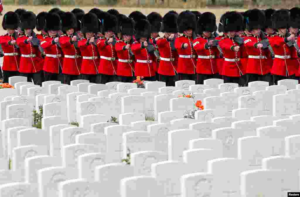 Irish Guards march at the Tyne Cot cemetery ahead of a commemoration to mark the centenary of Passchendaele, The Third Battle of Ypres, in Zonnebeke, Belgium.