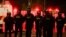 FILE - Police officers stand in formation during a protest in the Loyalist Tigers Bay Area of Belfast, Northern Ireland, April 9, 2021. 