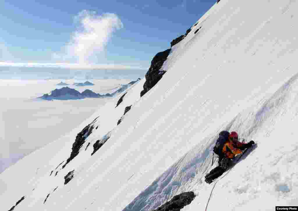 Hamish Pritchard on a British Antarctic Survey expedition in the Herschel Heights, Alexander Island. Rock samples can tell us when these summits emerged from the retreating ice sheet. (Photo courtesy of Mike Brian)