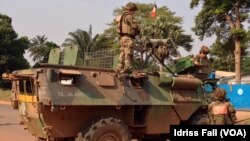 A man watches the giant steel artwork &quot;Bending&quot; as part of the China 8 exhibition of contemporary art by Chinese artist Yue Minjun in Duesseldorf, Germany.