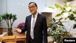 Self-exiled Cambodian opposition party founder Sam Rainsy speaks during an interview with Reuters prior to his departure to Bangkok on Thursday from his Paris base, France, November 6, 2019. 