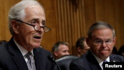 U.S. Senate Foreign Relations Committee Bob Corker, R-TN, speaks as ranking member Senator Bob Menendez, D-NJ, looks on during a Senate Foreign Relations Committee hearing on Capitol Hill in Washington, July 25, 2018.
